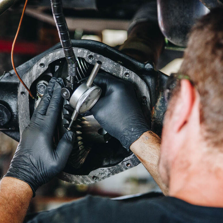 mechanic re-gearing a Jeep axle