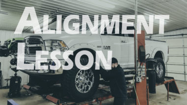 Alignment less YouTube thumbnail featuring white dodge ram 1500 on alignment rack