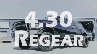 4.30 regear youtube thumbnail showing black dually dodge ram with offroad protection bumper and bed cap