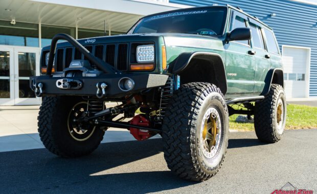 Green Jeep Cherokee with bumper beadloack wheels, king shocks and fenders