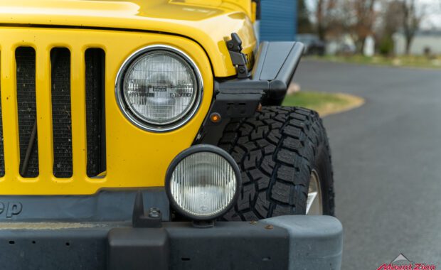 2006 Jeep Wrangler Unlimited in Solar Yellow driver side headlight, fog light, metalcloak flares