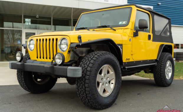 2006 Jeep Wrangler Unlimited in Solar Yellow with metal cloak flares