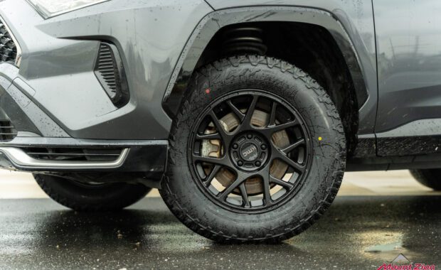 2021 Toyota Rav4 Gray, Eibach Pro Lift, black KMC wheels, front left wheel detail