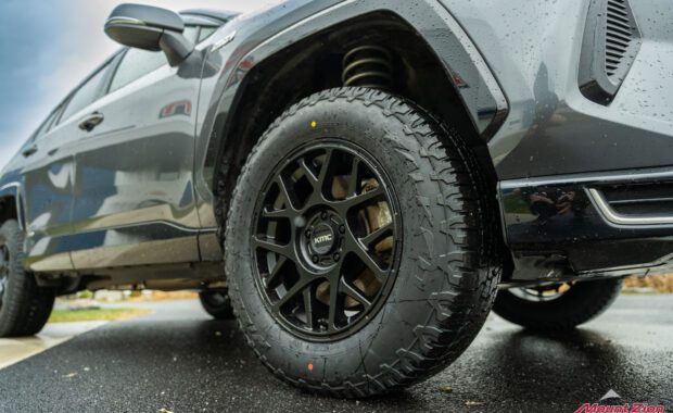 2021 Toyota Rav4 Gray, Eibach Pro Lift, black KMC wheels, passenger front low angle