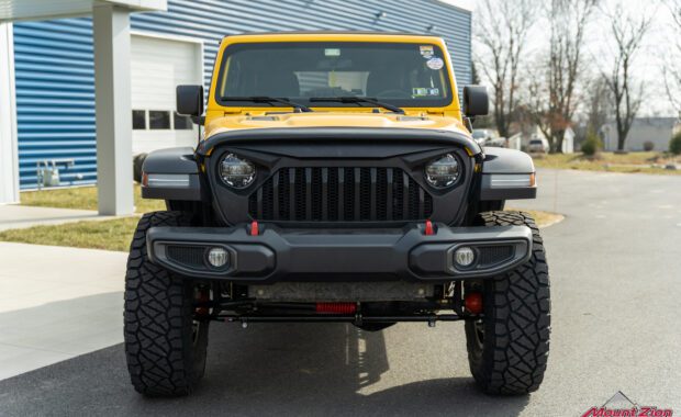 Lifted yellow Rubicon on 38's, front view