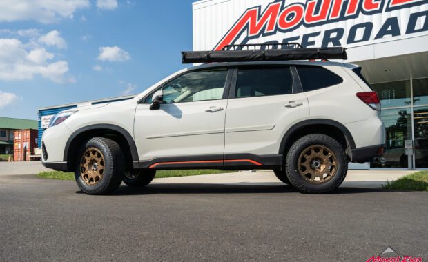 White 2019 Subaru Forester Sport with method wheels and falken tires on 2019 subaru forester sport with roof basket driver side view