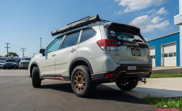 White 2019 Subaru Forester Sport with method wheels and falken tires on 2019 subaru forester sport with roof basket driver tailgate side view