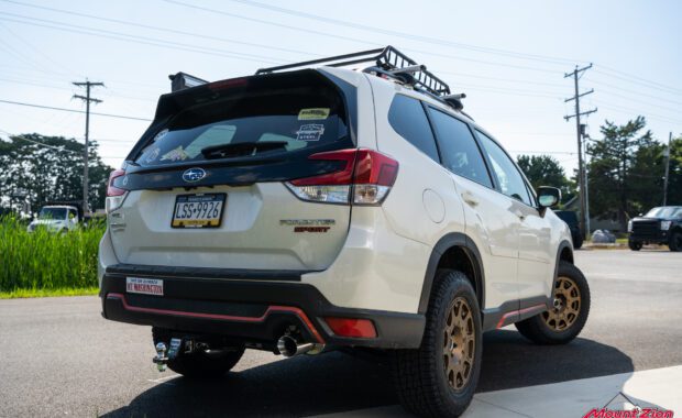 White 2019 Subaru Forester Sport with method wheels and falken tires on 2019 subaru forester sport with roof basket tailgate passenger side view