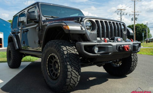 2022 Jeep Wrangler Unlimited Rubicon in Granite Crystal with Method 305 and Nitto Ridge Grappler 37x12.50R17 front passenger side