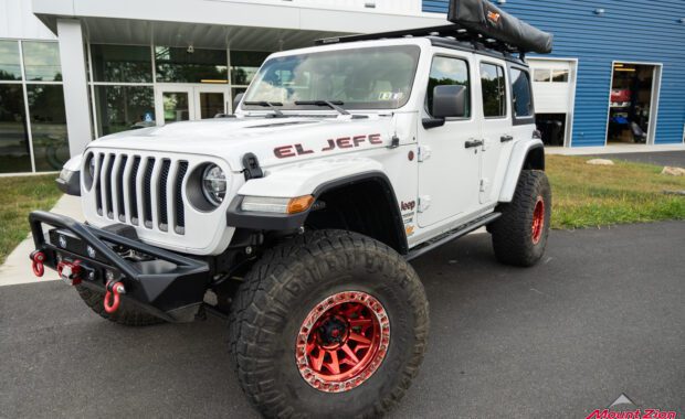 2020 Jeep Wrangler Unlimited Rubicon red beadlock wheels and overland roof rack