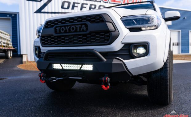 driver side grille view of 2020 Toyota Tacoma TRD Sport Body Armor Winch Bumper with Smittybilt Gen 3 XRC Comp 9500 Winch and 20