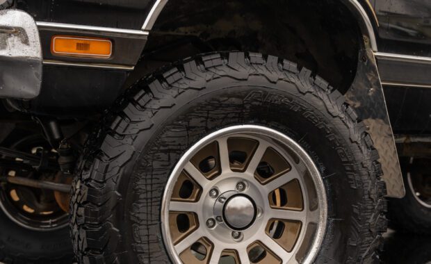 Black with Gold Stripping 1985 dodge ram charger BFgoodrich tire with front driver side wheel well