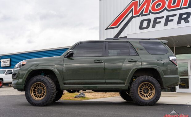 2022 toyota 4runner with bronze kmc wheels and falken wildpeak tires at mount zion offroad driver side view