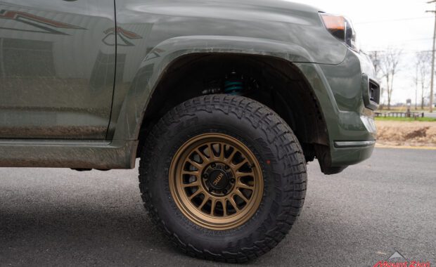 2022 toyota 4runner with bronze kmc wheels and falken wildpeak tires front passenger wheel well