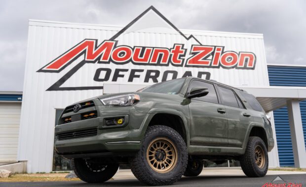 2022 toyota 4runner with bronze kmc wheels and falken wildpeak tires at mount zion offroad low front driver side view
