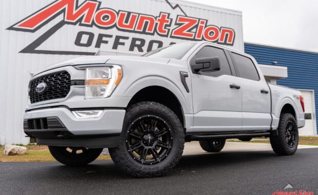 white ford f150 front driver side with toyo tires open country A/T and Helo wheel at mount zion offroad