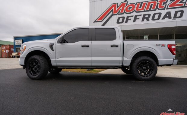 Leveled White Ford F150 STX with Toyo Open Country Tires at mount zion offroad