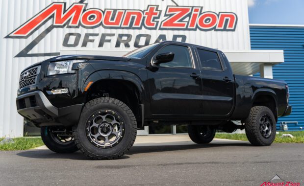 2022 Nissan Frontier front driver side with KMC Dirty Harry Satin Gray Black Lip 18X8.5 +18 with General Grabber ATX LT265/70R18 at mount zion off-road
