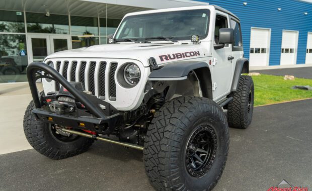 2022 Jeep wrangler rubicon on fuel wheels and nitto tires with front bumper push bar driver side view