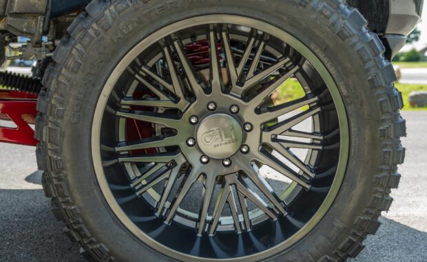 28x15.5R24LT Fury Country hunter tire on cali off-road wheels on lifted Ram 2500