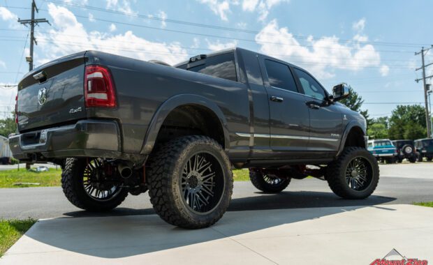 Grey 2022 Ram 2500 limited lifted with offroad tires and wheels at mount zion offroad passenger side rear angle