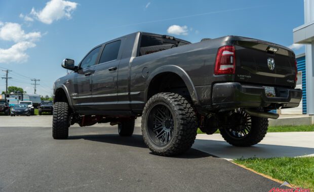 Grey 2022 Ram 2500 limited lifted with offroad tires and wheels at mount zion offroad driver side angle