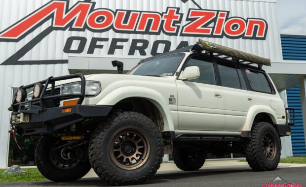 1994 toyota land cruiser lifted with black rhino wheels and toyo tires, front bumper, snorkel, roof rack, rock rails, and rear bumper at mount zion offroad