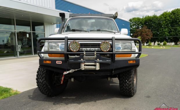 1994 toyota land cruiser lifted with black rhino wheels and toyo tires, front bumper, snorkel, roof rack, rock rails, and rear bumper at mount zion offroad