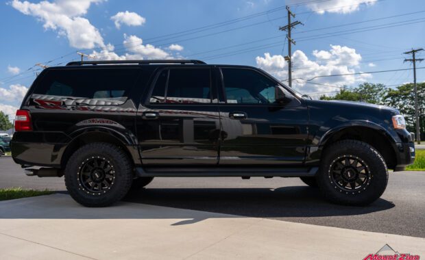 Black 2017 Ford Expedition with Bilstein suspension with method wheels and falken wildpeak tires side view