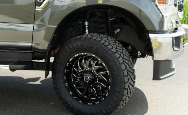 2020 ford F250 Superduty lifted Fox suspension with TIS wheels and Nitto Tires built by Mount Zion Offroad front passenger wheel
