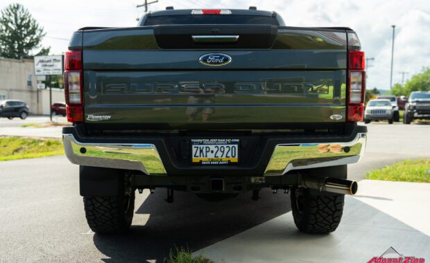 2020 ford F250 Superduty lifted Fox suspension with TIS wheels and Nitto Tires tailgate