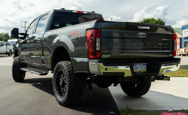 2020 ford F250 Superduty lifted Fox suspension with TIS wheels and Nitto Tires built by Mount Zion Offroad rear driver side tailgate