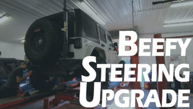 Beefy Steering upgrade YouTube thumbnail featuring white jeep on lift