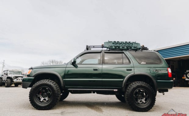 Green 4runner front grille with winch and roof rack driver side view