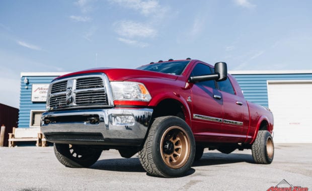 red dodge ram with method race wheels front driver side grille view