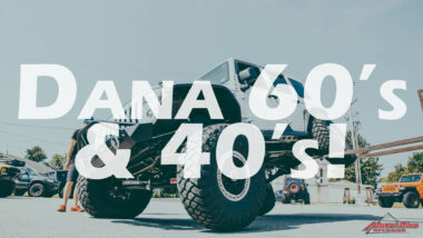 Dana 60's & 40's youtube thumbnail featuring white jeep being lifted by forklift from rear tire