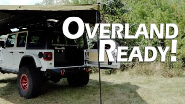 Overland ready YouTube build thumbnail with white jeep and awning
