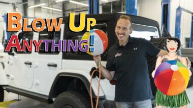 Blow up Anything Thumbnail with white jeep and hula girl holding beach ball