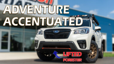 adventure accentuated YouTube thumbnail with a lifted white forester with roof basket and method wheels