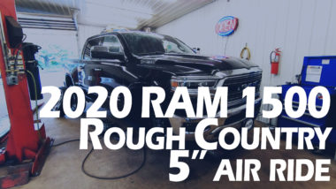 2020 Ram 1500 Rough Country 5" Air Ride YouTube thumbnail featuring black ram on lift in shop