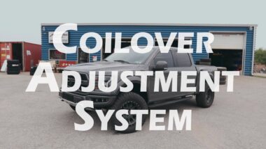 coilover adjustment system youtube thumbnail featuring grey ford raptor at blue shop