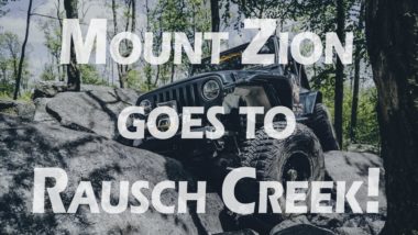Mount Zion goes to Rausch Creek YouTube Thumbnail jeep crawling over rocks in green woods