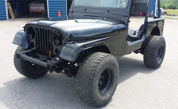Black restore jeep with upgraded wheels and tires