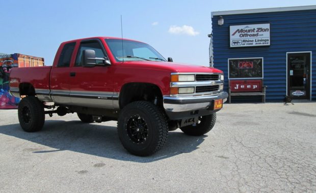 Red Chevy lifted on fuel wheels and offroad tires at mount zion offroad