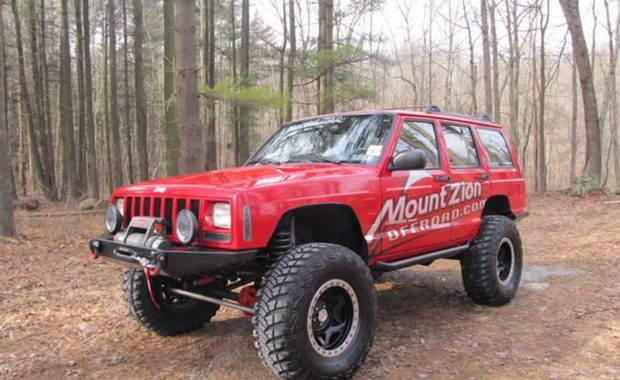 Red Jeep with Mount Zion Offroad on side