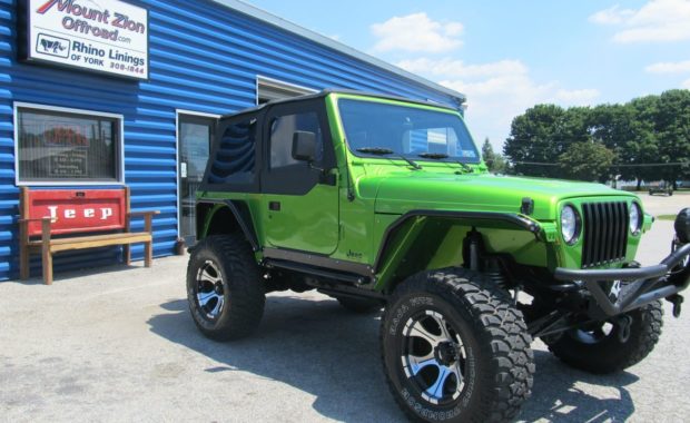 Lime Green Jeep with push bar and soft top