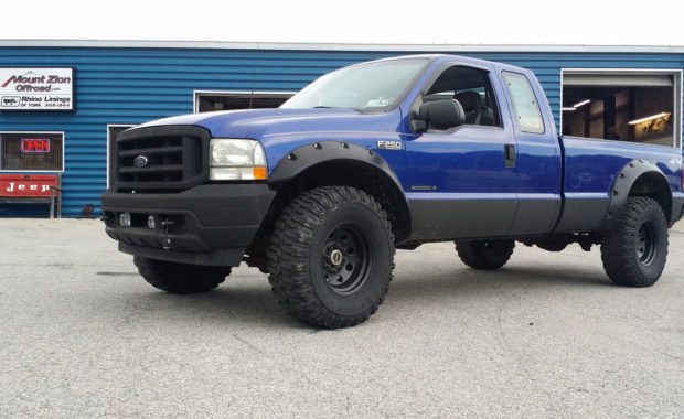 Blue F250 with small lift and offroad wheels