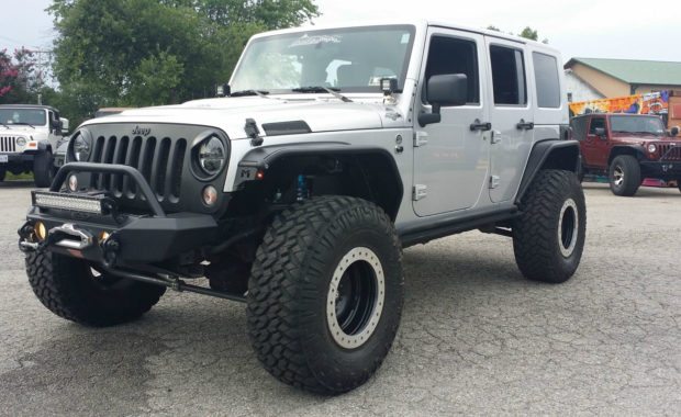 Silver jeep with metalcloa flares and warn winch