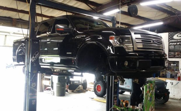 Black F150 on lift at mount zion off-road