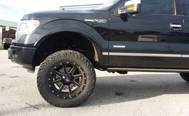 Lifted Black F150 with Fuel wheels front drivers side wheel